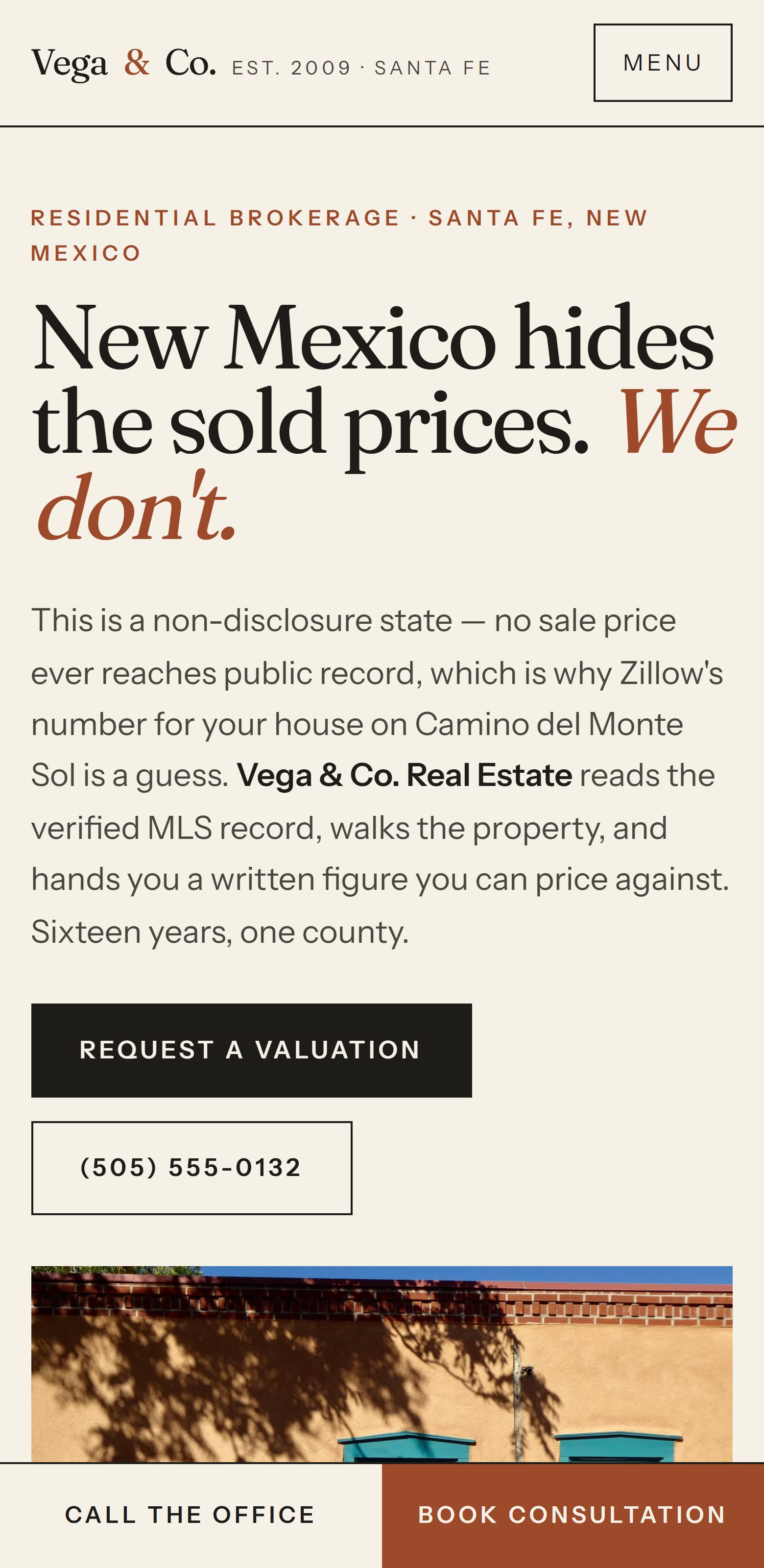 Vega & Co. Real Estate on a phone